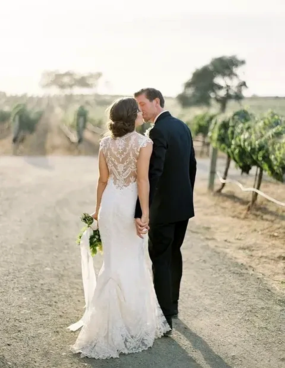 Bride showing detailed lace dress